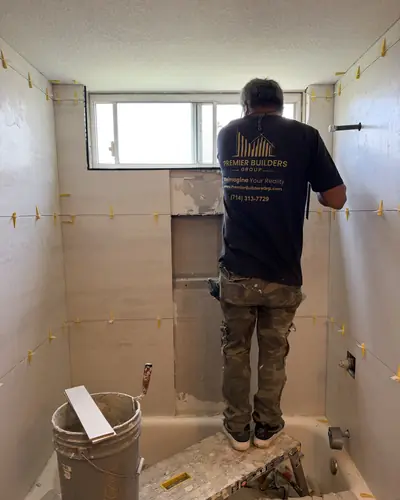 Our crew setting the wall tile